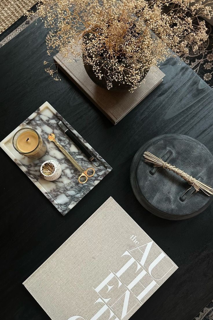 Calcutta Viola marble tray styled with luxury home accessories on dark slate surface - handcrafted Italian stone tray with burgundy veining displayed alongside brass candle, dried flowers, and modern decor pieces"
This alt text includes:
Your product name (Calcutta Viola marble tray)
Key materials (Italian stone, burgundy veining)
Styling context (luxury home accessories, dark slate surface)
Specific items shown (brass candle, dried flowers, modern decor)
SEO keywords (handcrafted, luxury, marble tray)
You 