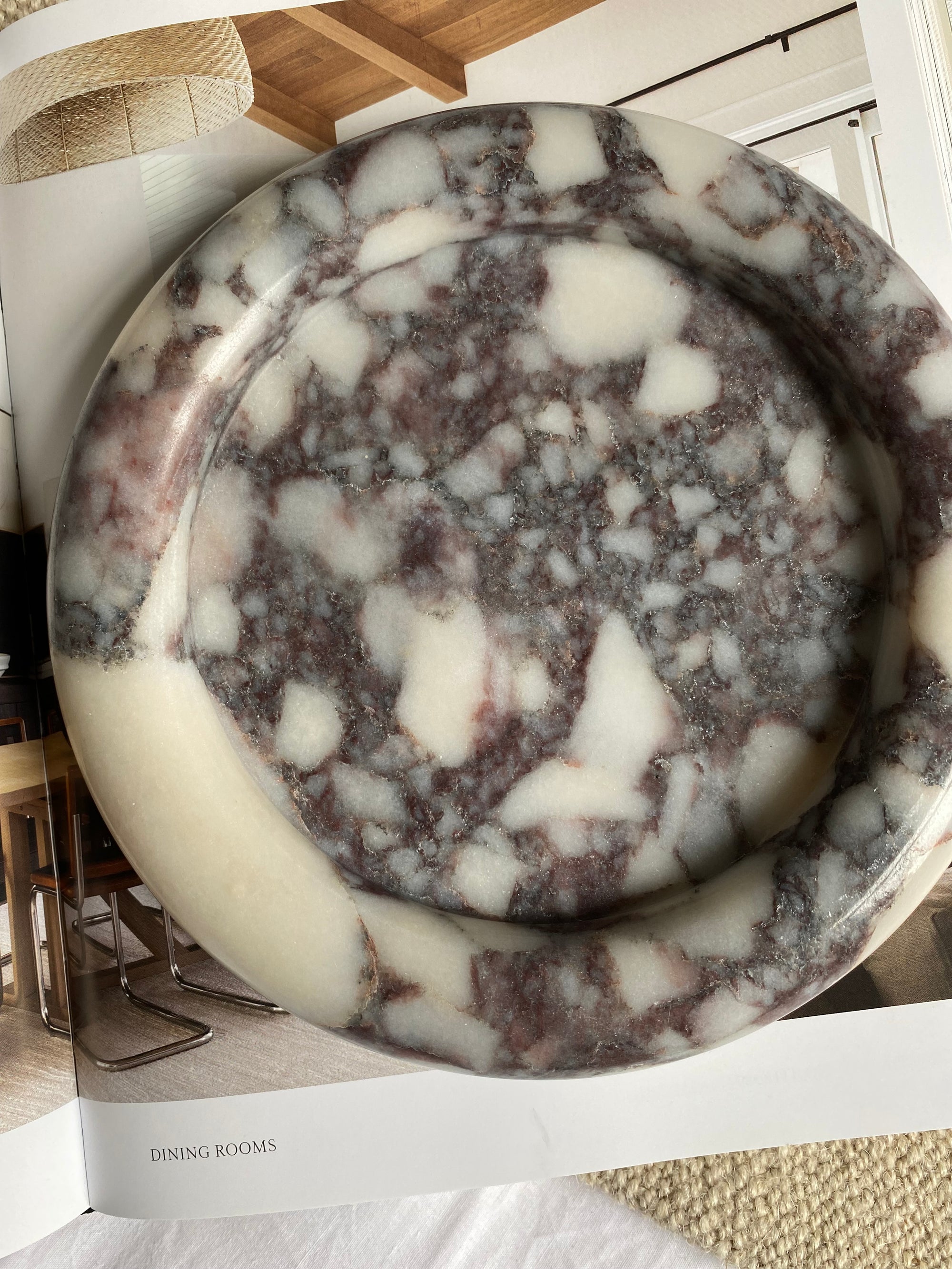 Marble-patterned tray on a decorative book